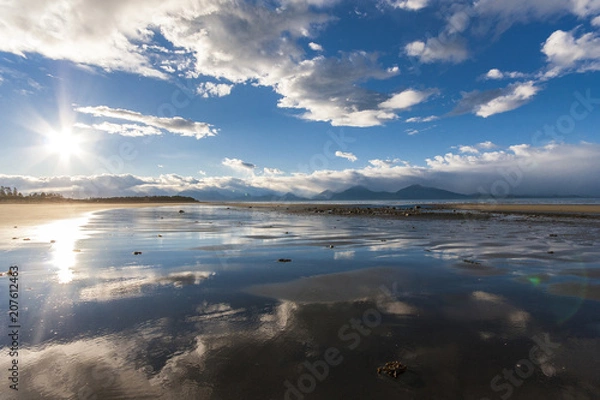 Fototapeta Reflection of sky in sandy beach of Alaska. Near Homer.