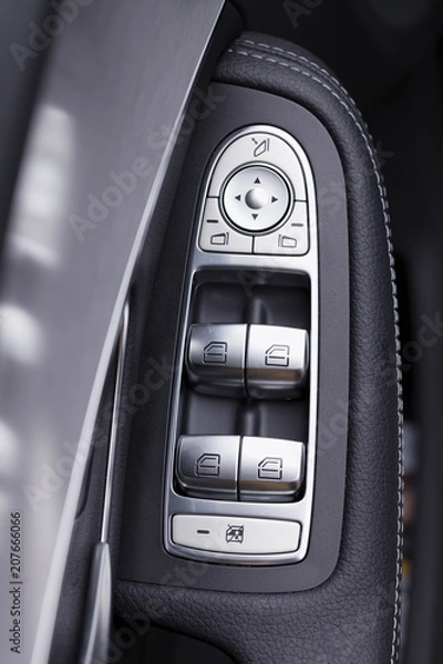 Fototapeta The buttons that we can find in the door of a modern car