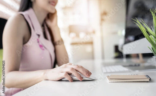 Fototapeta Close up woman hand using mouse working with pc computer