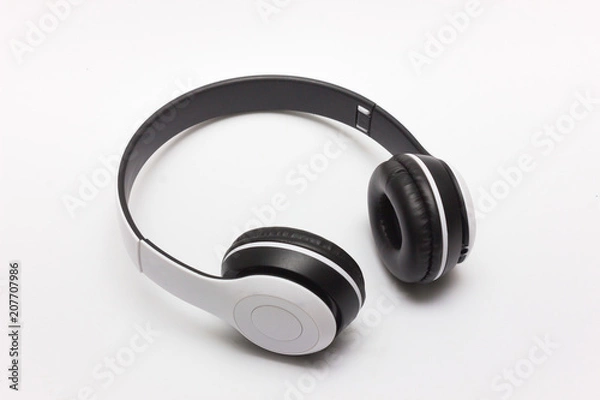 Fototapeta White wireless headphones isolated on white background