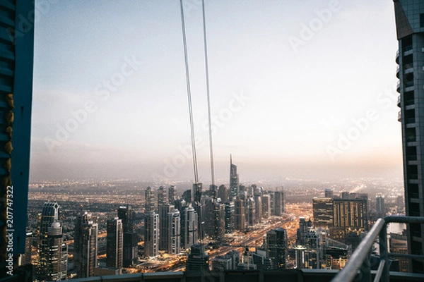 Fototapeta Dubai downtown view from Burj Khalifa on buildings in evening.