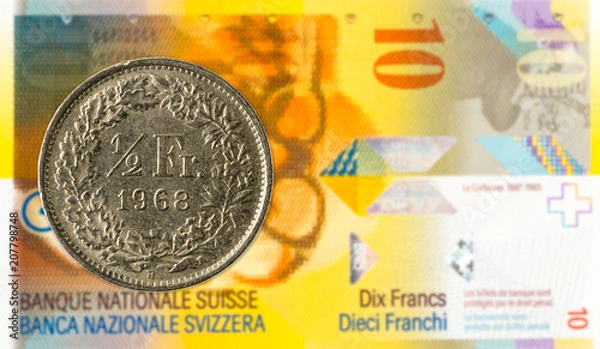 Fototapeta 0,5 swiss franc coin against 10 swiss franc bank note