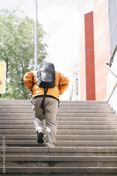 Fototapeta Bearded man on the stairs of the Madrid subway