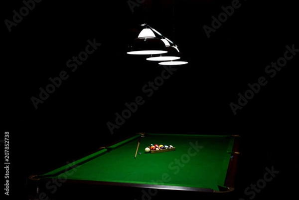 Fototapeta Game of billiards on a table with green cloth 
