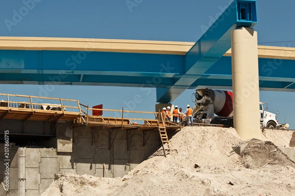 Fototapeta Men doing construction work