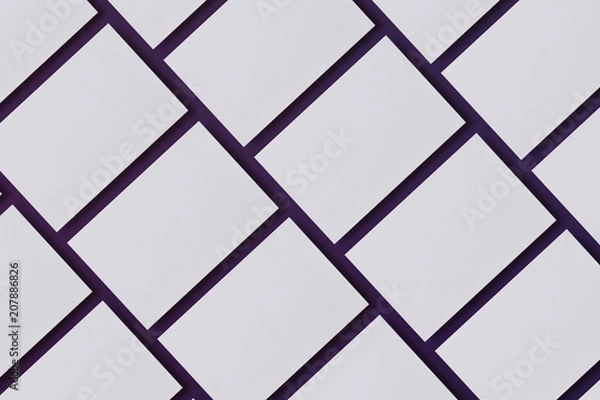 Obraz Photo of blank business cards. Mock-up for branding identity. For graphic designers presentations and portfolios. Business cards stacks arranged in rows on blue textured paper background