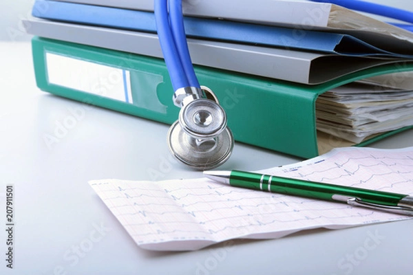 Fototapeta books folder file, stethoscope and RX prescription isolated on white background.