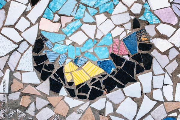Fototapeta Fragment of a ceramic mosaic. An imitation of the style of Antoni Gaudi. Background, copy space.