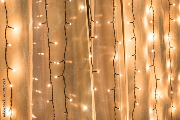 Fototapeta Glowing garlands in the interiors. Luminous texture.
