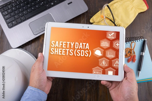 Fototapeta SAFETY DATA SHEETS (SDS) on tablet pc, Safety & Health at Work Concepts