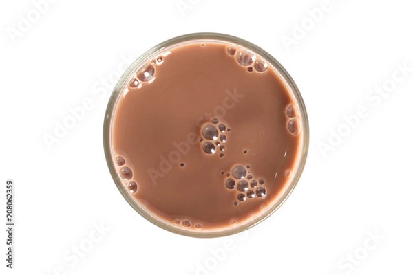 Fototapeta Glass of chocolate milk isolated on white background, top view