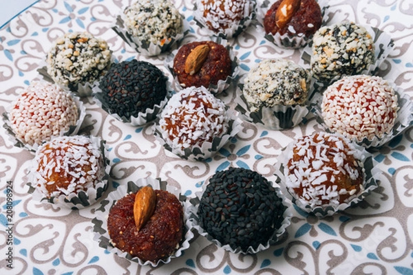 Fototapeta sweets from dried fruits with nuts and sesame seeds