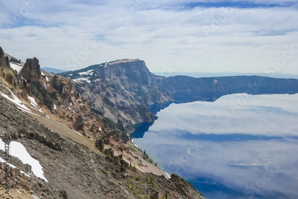 Fototapeta Beautiful scenery of the volcanic shoreline as seen from the east rim in Crater Lake, Oregon, USA