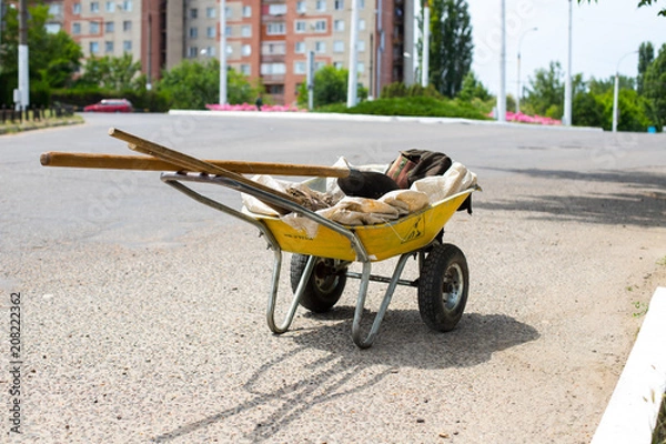 Obraz yellow garden wheelbarrow with tools