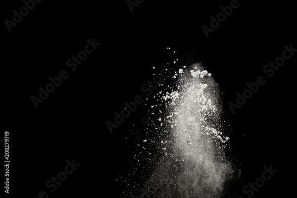 Fototapeta Bizarre forms of of white powder explosion cloud against dark background.Launched white dust splash on black background.