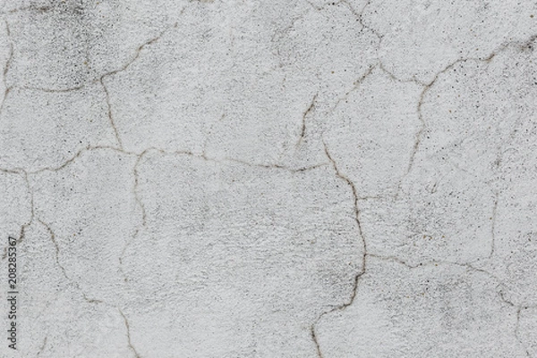 Fototapeta Wall fragment with scratches and cracks