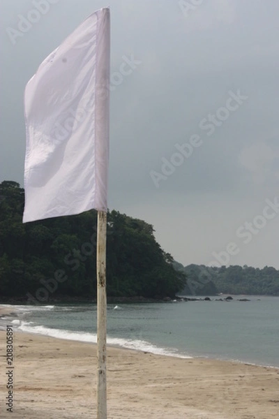 Obraz White flag on the beach