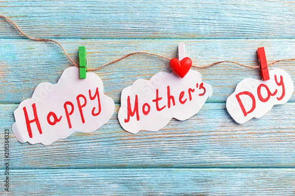 Fototapeta Creative composition with text MOTHER'S DAY on wooden background