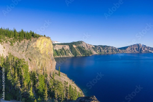 Fototapeta Beautiful scenery of the volcanic cliff as seen from the north rim in Crater Lake, Oregon, USA