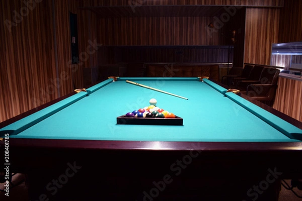 Obraz Colored balls of the American pool are collected in a triangle on a billiard table