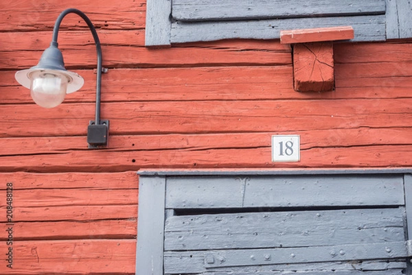 Obraz Number 18 and lamp on red wall