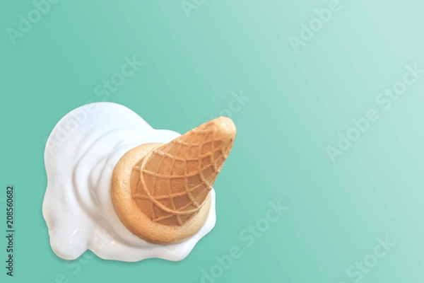 Obraz Ice cream cone fallen on blue vintage background.