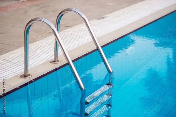 Fototapeta Metal staircase for exit from the pool