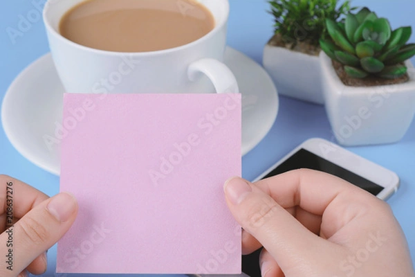 Fototapeta Woman's hand holding empty card