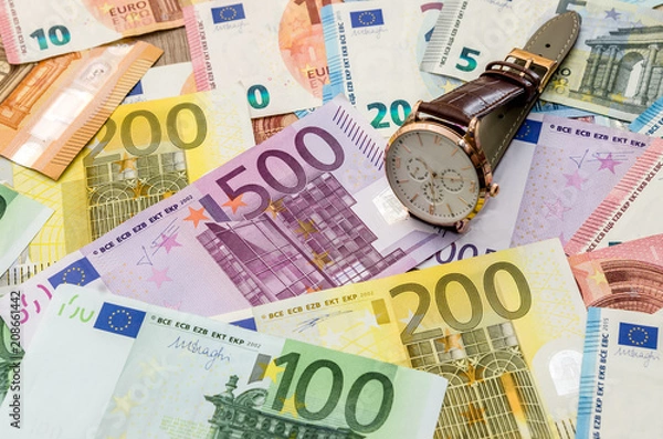 Fototapeta Clock on euro banknotes. close up .