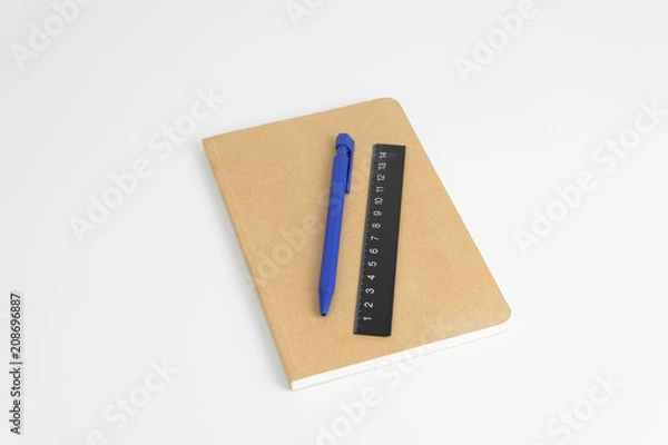 Fototapeta Stationery set such as Note books Ruler and Pens on white background.
