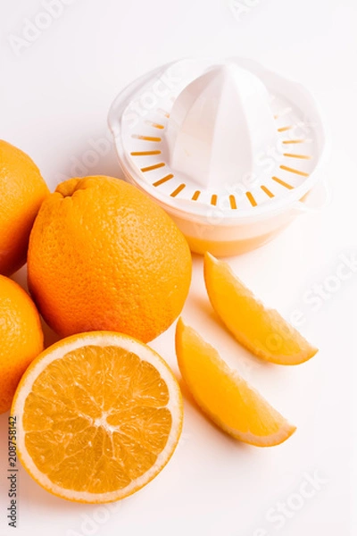 Obraz oranges and juice on a white background