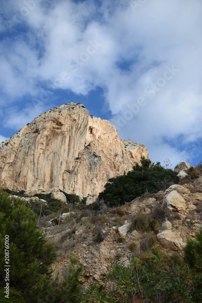 Fototapeta A beautiful view of Mount Ifach In Spain, the city of Calpe and the blue Spanish sky with white clouds