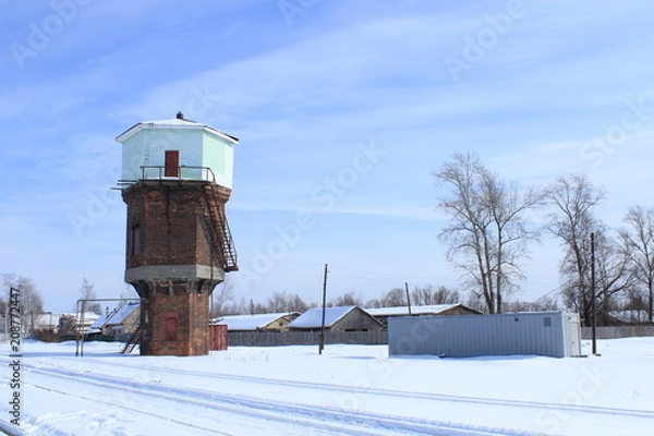 Fototapeta Водонапорная башня на станции Тумская в марте