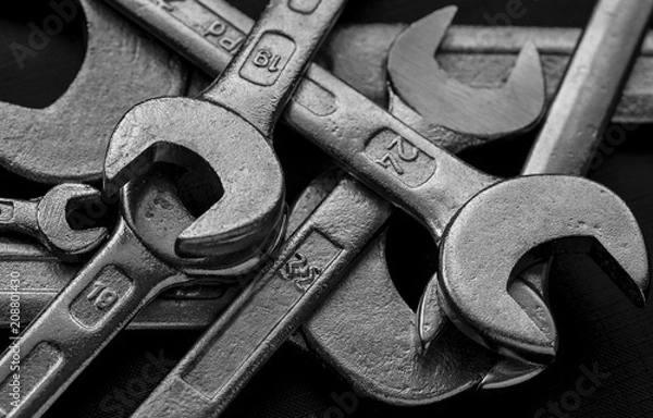 Fototapeta Tool wrenches on a black background