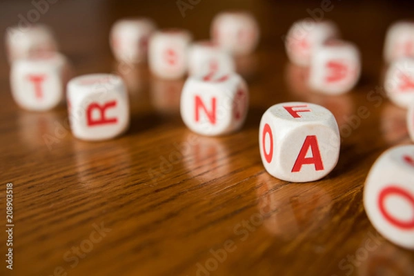 Fototapeta Letters dices on wooden table