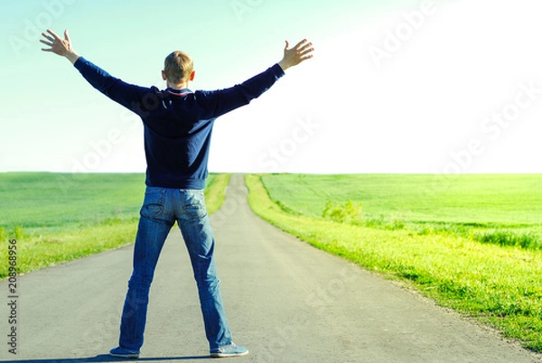 Fototapeta Lonely man on an empty road