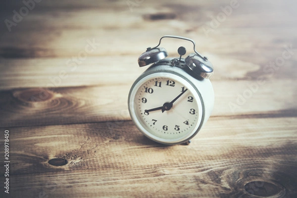 Fototapeta vintage watch on wooden table background