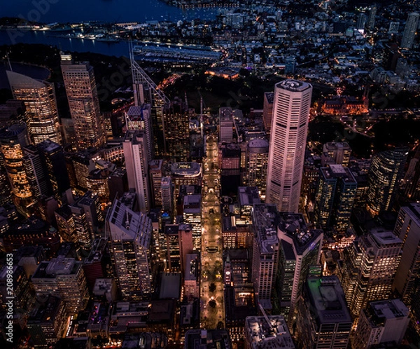 Fototapeta Tall buildings in the city and in the evening from above