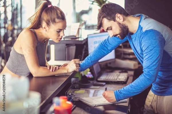 Fototapeta Checking at gym.