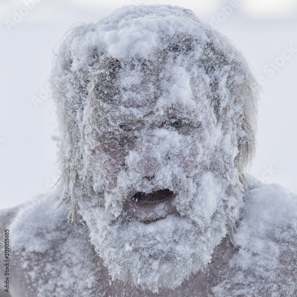Fototapeta Portrait of a bearded man in the snow