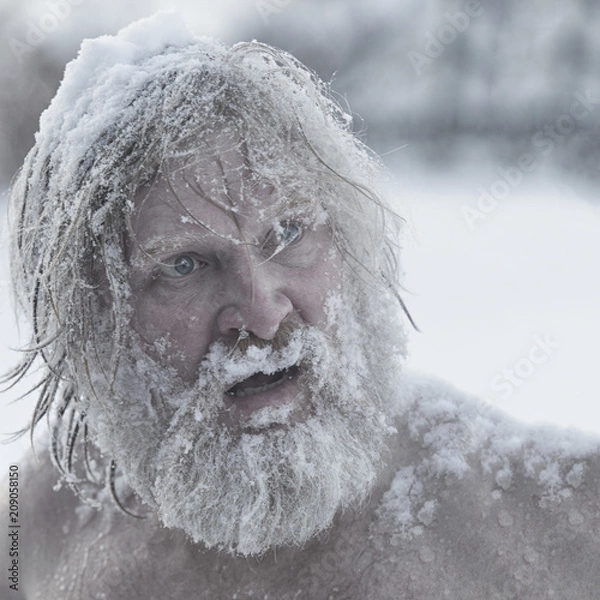 Fototapeta Portrait of a bearded man in the snow