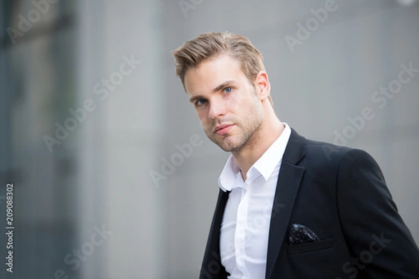 Obraz Businessman on the go. Guy handsome attractive office worker go meeting. Man well groomed elegant formal suit walks urban background. Businessman serious quick walk during lunch time