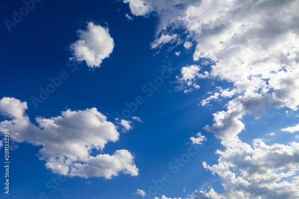 Obraz Blue sky background with clouds.