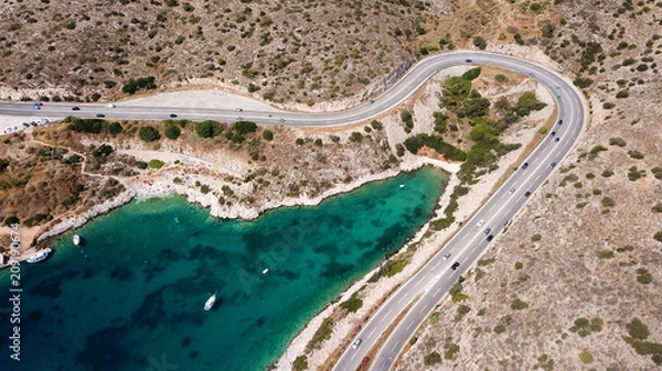 Fototapeta Aerial drone bird's eye view photo of Tunnel in Athens riviera seaside road known as hole of Karamanlis, Attica, Greece