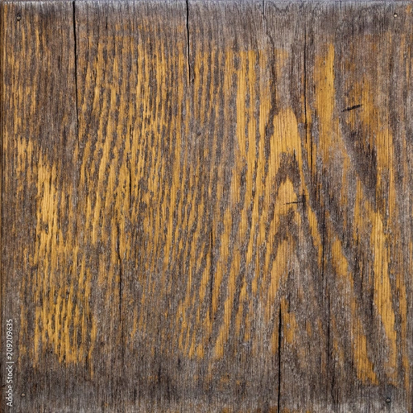 Fototapeta Old worn boardwalk with peeling varnish and many scratches and cracks
