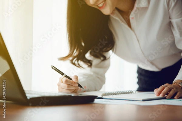 Fototapeta Beautiful young Asia woman working in office