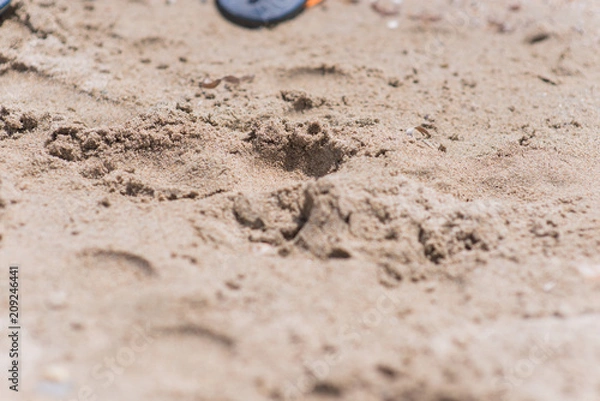 Fototapeta Beach sand overlooking small waves