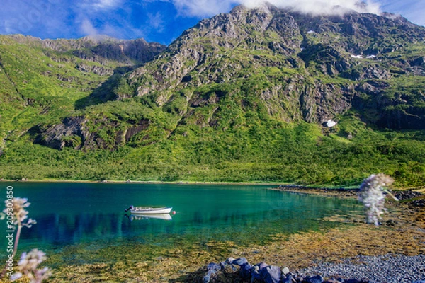Obraz White boat in the lake with view to mountains in the Norway at summer