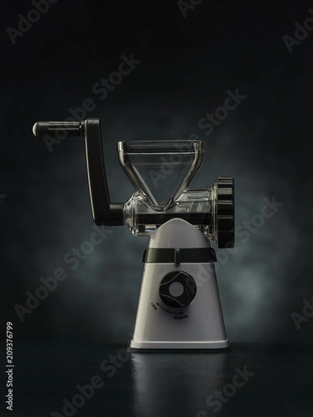 Fototapeta mechanical meat grinder on darck background.