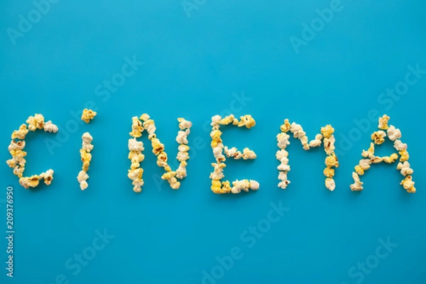 Fototapeta Food. Frozen Popcorn Corn Popcorn Bucket. Delicious Popcorn on Blue Background. Cinema.